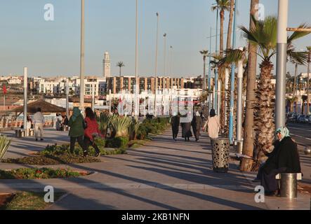 People walk along the Cornish in Casablanca, Morocco, Africa. The Cornish of Casablanca is a beautiful stretch along the Atlantic coast. The serpentine road has a parallel walkway for the pedestrians and there are a number of hotels, restaurants, and nightclubs located along the Cornish. (Photo by Creative Touch Imaging Ltd./NurPhoto) Stock Photo