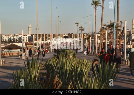 People walk along the Cornish in Casablanca, Morocco, Africa. The Cornish of Casablanca is a beautiful stretch along the Atlantic coast. The serpentine road has a parallel walkway for the pedestrians and there are a number of hotels, restaurants, and nightclubs located along the Cornish. (Photo by Creative Touch Imaging Ltd./NurPhoto) Stock Photo