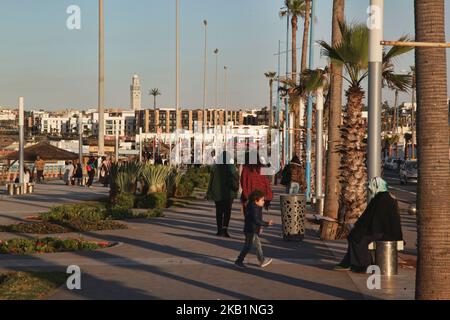 People walk along the Cornish in Casablanca, Morocco, Africa. The Cornish of Casablanca is a beautiful stretch along the Atlantic coast. The serpentine road has a parallel walkway for the pedestrians and there are a number of hotels, restaurants, and nightclubs located along the Cornish. (Photo by Creative Touch Imaging Ltd./NurPhoto) Stock Photo