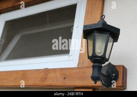 Old iron street lantern on a house  wall Stock Photo