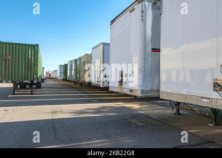 Row of many trucking trailers
