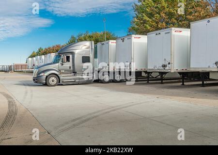 Row of many trucking trailers