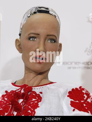 Social humanoid robot Sophia, a creation by Hanson Robotics company, dressed in vyshyvanka, the traditional Ukrainian embroidered blouse, speaks during a press conference at the 'Olerom Forum One 2018' business forum in Kiev, Ukraine, on 13 October, 2018. The business forum bring togethers speakers of world arena, owners and managers of major companies, top managers and investors. (Photo by STR/NurPhoto) Stock Photo