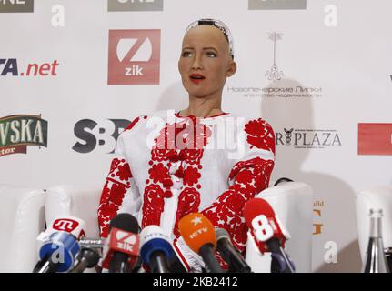 Social humanoid robot Sophia, a creation by Hanson Robotics company, dressed in vyshyvanka, the traditional Ukrainian embroidered blouse, speaks during a press conference at the 'Olerom Forum One 2018' business forum in Kiev, Ukraine, on 13 October, 2018. The business forum bring togethers speakers of world arena, owners and managers of major companies, top managers and investors. (Photo by STR/NurPhoto) Stock Photo