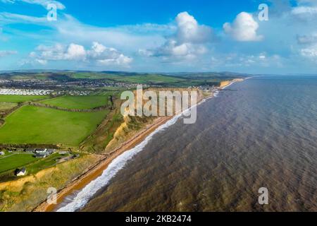 Eype, Dorset, UK.  3rd November 2022.  UK Weather.  View from the air of the beach and cliffs at Eype Mouth on the Dorset Jurassic Coast looking towards West Bay on an afternoon of autumn sunshine after heavy overnight rain.  The cliffs here are prone to frequent landslips and rockfalls.  Picture Credit: Graham Hunt/Alamy Live News Stock Photo