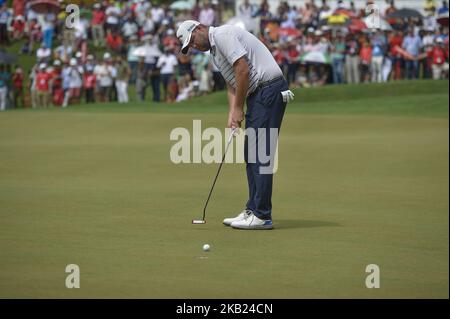 Marc Leishman of Australia plays a putt on the 18th green during the final round of CIMB Classic golf tournament in Kuala Lumpur, Malaysia on October 14, 2018. (Photo by Zahim Mohd/NurPhoto) Stock Photo