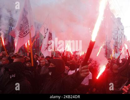 Ukrainian far-right activists attend a march to the 76th anniversary of the establishment of the Ukrainian Insurgent Army (UPA) in central Kiev, Ukraine, on 14 October, 2018. The activists gathered in the Ukrainian capital to celebrate the 76th anniversary of the establishment of the Ukrainian Insurgent Army (UPA). (Photo by Vladimir Sindeyeve/NurPhoto  )  Stock Photo