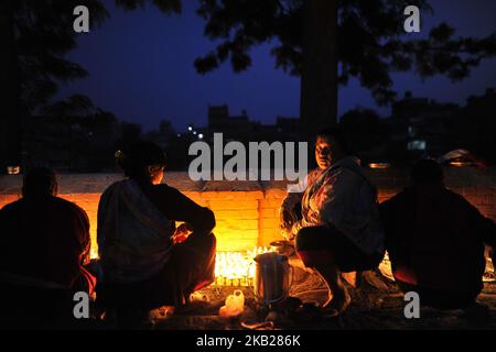 Nepalese Devotee offering butter lamps infornt Bramayani Temple during the tenth day of Dashain Durga Puja Festival in Bramayani Temple, Bhaktapur, Nepal on Friday, October 19, 2018. Dashain is the most auspicious and biggest celebrated festival in Nepal, which reflects age old traditions and the devotion of the Nepalese towards Goddess Durga. (Photo by Narayan Maharjan/NurPhoto) Stock Photo