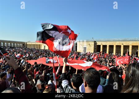 A visitor waves the Turkish national flag while people visit Anitkabir, the mausoleum of Mustafa Kemal Ataturk, modern Turkey's founding president, on the 95th anniversary of the Republic Day of Turkey in Ankara on October 29, 2018. The Republic Day is one of the public holidays in the country commemorating the proclamation of the Republic of Turkey, 95 years ago in 1923. The Republic Day commemorates the events of October 29, 1923, when Ataturk declared that Turkey was henceforth a republic. (Photo by Altan Gocher/NurPhoto) Stock Photo