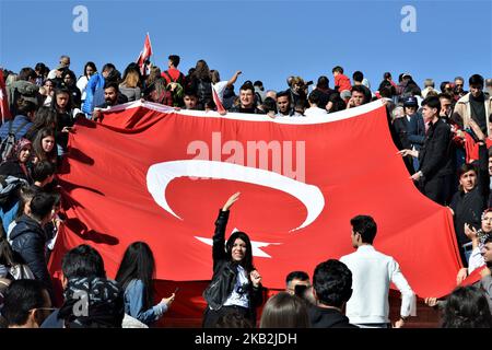 Visitors carry the Turkish national flag at Anitkabir, the mausoleum of Mustafa Kemal Ataturk, modern Turkey's founding president, on the 95th anniversary of the Republic Day of Turkey in Ankara on October 29, 2018. The Republic Day is one of the public holidays in the country commemorating the proclamation of the Republic of Turkey, 95 years ago in 1923. The Republic Day commemorates the events of October 29, 1923, when Ataturk declared that Turkey was henceforth a republic. (Photo by Altan Gocher/NurPhoto) Stock Photo