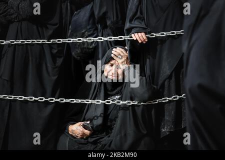 In Karbala, Iraq, on October 30, 2018, millions of Shi'a Muslims gather in the holy city of Karbala, specifically at the holy threshold of Husseiniya each year, on the 40th anniversary of Imam Hussein, peace be upon him, who died in Karbala more than a thousand years ago. Where they salute the mourning and condolences in the middle of the threshold, with the visit of the Imam and the blessed the great shrine. (Photo by Sayed Baqer AlKamel/NurPhoto) Stock Photo