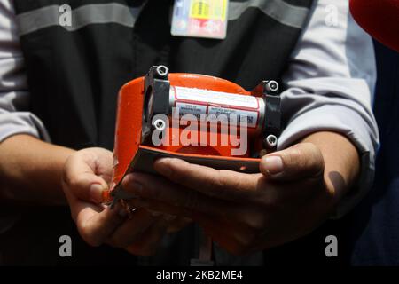 Head of the National SAR Agency, Vice Marshal Syaugi, shows the Lion Air JT610 flight data recorder to media crew on the Baruna Jaya I research vessel at Karawang bay, West java, on November 1, 2018. The join SAR team succesfully find and evacuated the Lion Air B737 Max 8 flight data recorder on the 4th day of SAR operation after the aircraft crash on the Karawang bay, minutes after take off from Jakarta. (Photo by Aditya Irawan/NurPhoto) Stock Photo