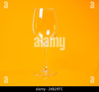 empty glass empty jar empty ice bucket on orange background top front view isolated Stock Photo