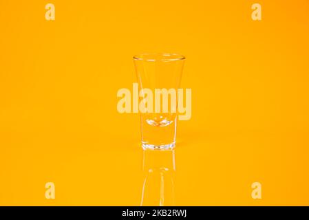empty glass empty jar empty ice bucket on orange background top front view isolated Stock Photo