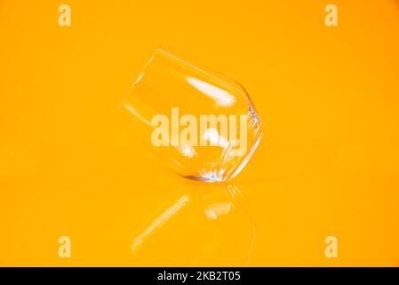 empty glass empty jar empty ice bucket on orange background top front view isolated Stock Photo