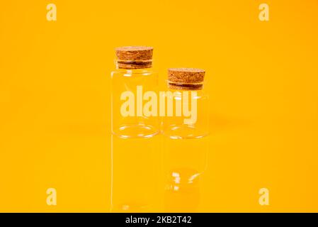 empty glass empty jar empty ice bucket on orange background top front view isolated Stock Photo