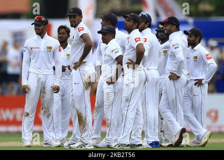 Sri Lankan cricketers look on for a 3rd Umpire's decision during the 1st day's play of the first test cricket match between Sri Lanka and England at Galle International cricket stadium, Galle, Sri Lanka on November 6, 2018. (Photo by Tharaka Basnayaka/NurPhoto) Stock Photo