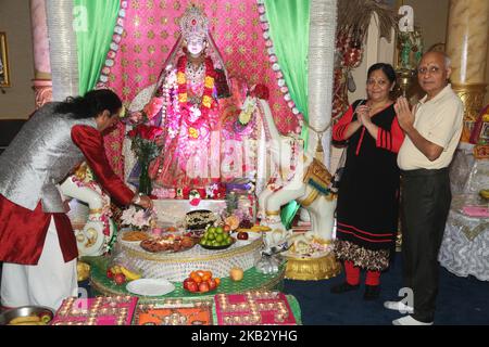 Hindu devotees perform Lakshmi puja during the festival of Diwali (Deepawali) at a Hindu temple in Toronto, Ontario, Canada on November 7, 2018. Lakshmi (Laxmi) is the Hindu Goddess of wealth and prosperity. (Photo by Creative Touch Imaging Ltd./NurPhoto) Stock Photo