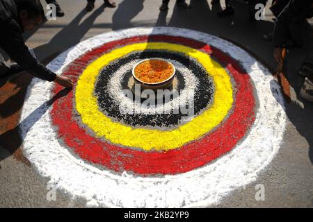 A man making mandala greetings for the parade of Nhu Dan (the Newari New Year), which falls on Tihar or Deepawali and Dewali “Festival of Lights” at Kirtipur, Kathmandu, Nepal on Thursday, November 08, 2018. Newar community in Nepal observes Newari New Year 1139. (Photo by Narayan Maharjan/NurPhoto) Stock Photo