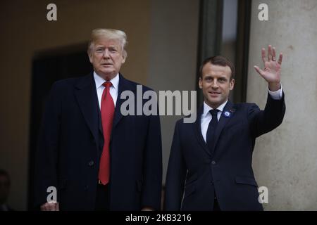 US President Donald Trump (L) is welcomed by French President Emmanuel Macron as he arrives for bilateral talks at the Elysee Palace in Paris on November 10, 2018 on the sidelines of commemorations marking the 100th anniversary of the 11 November 1918 armistice, ending World War I. (Photo by Mehdi Taamallah/NurPhoto) Stock Photo