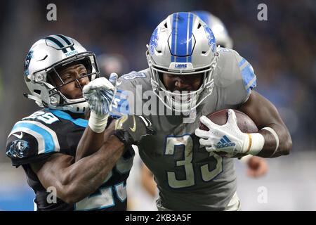 Detroit Lions running back Kerryon Johnson (33) runs the ball against Carolina Panthers free safety Mike Adams (29) during the second half of an NFL football game in Detroit, Michigan USA, on Sunday, November 18, 2018. (Photo by Jorge Lemus/NurPhoto) Stock Photo