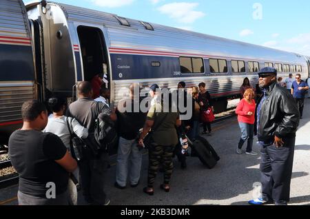 Passengers board a northbound Amtrak train on Thanksgiving eve at the Amtrak station in Orlando, Florida on November 21, 2018. Amtrak says it is prepared for one of its busiest Thanksgiving weeks and is adding more trains on certain routes and more cars to some existing trains to accommodate increased numbers of passengers. (Photo by Paul Hennessy/NurPhoto) Stock Photo