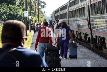 Passengers prepare to board a northbound Amtrak train on Thanksgiving eve at the Amtrak station in Orlando, Florida on November 21, 2018. Amtrak says it is prepared for one of its busiest Thanksgiving weeks and is adding more trains on certain routes and more cars to some existing trains to accommodate increased numbers of passengers. (Photo by Paul Hennessy/NurPhoto) Stock Photo