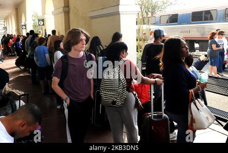 Passengers wait to board a northbound Amtrak train on Thanksgiving eve at the Amtrak station in Orlando, Florida on November 21, 2018. Amtrak says it is prepared for one of its busiest Thanksgiving weeks and is adding more trains on certain routes and more cars to some existing trains to accommodate increased numbers of passengers. (Photo by Paul Hennessy/NurPhoto) Stock Photo