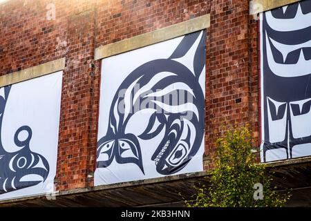 Northwest Coast Indian art, graphics, on a brick wall in Bellingham, Washington, USA Stock Photo