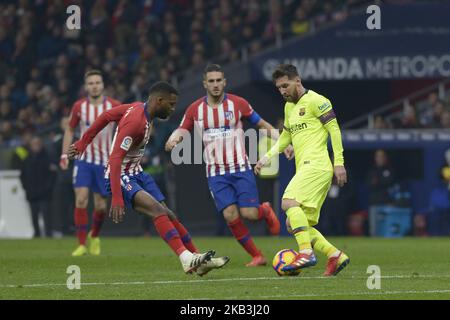 Lemar of Atletico de Madrid of Atletico de Madrid fight the ball with Lionel Messi Barcelona during a match between Atletico de Madrid vs Barcelona for Spanish League 2018-2019 at Wanda Metropolitano Stadium on November 24, 2018 in Madrid, Spain. (Photo by Patricio Realpe/ChakanaNews) Stock Photo
