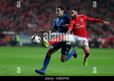 Benfica's Portuguese midfielder Rafa Silva (R ) fights for the ball with Feirense's defender Antonio Briseno during the Portuguese League football match SL Benfica vs Feirense at the Luz stadium in Lisbon, Portugal on December 1, 2018. ( Photo by Pedro FiÃºza/NurPhoto) Stock Photo