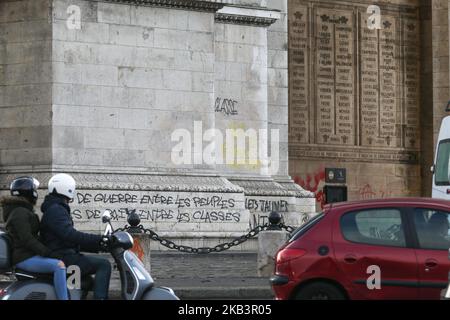 The pillars of the Arc de Triomphe monument tagged in Paris on December 2, 2018, a day after clashes during a protest of Yellow vests (Gilets jaunes) against rising oil prices and living costs. Anti-government protesters torched dozens of cars and set fire to storefronts during daylong clashes with riot police across central Paris, as thousands took part in fresh 'yellow vest' protests against high fuel taxes. (Photo by Michel Stoupak/NurPhoto) Stock Photo