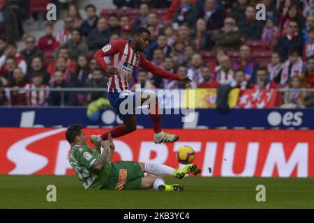 Lemar of Atletico de Madrid fight the ball with Navarro of Alaves during a match between Atletico de Madrid vs Alaves for Spanish League 2018-2019 at Wanda Metropolitano Stadium on December 8, 2018 in Madrid, Spain. (Photo by Patricio Realpe/PRESSOUTH) Stock Photo