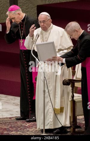 Pope Francis, flanked by Papal Household caretaker Monsignor Leonardo ...