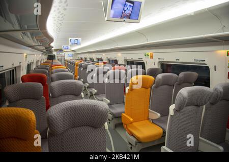 The interior of the Vibrant Express train, operated by MTR Corp is shown in West Kowloon Station in Hong Kong, China. 13 December 2018. Today A Hong Kong court ruled that a controversial arrangement (co-location) which allows mainland Chinese officers to apply national laws at the cityâ€™s new cross-border rail terminus is legally sound, The Guangzhou-Shenzhen-HÂong Kong Express Rail Link (XLR) which cost (US$10.8 billion ) went into operation on September 23.early this year. (Photo by Harry Wai/NurPhoto) Stock Photo