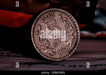 The Nepal government has banned the use of Indian currency notes of Rs 2,000, Rs 500 and Rs 200 denominations on 14 December 2018. A Five rupee Coin can be seen in this picture. (Photo by Nasir Kachroo/NurPhoto) Stock Photo