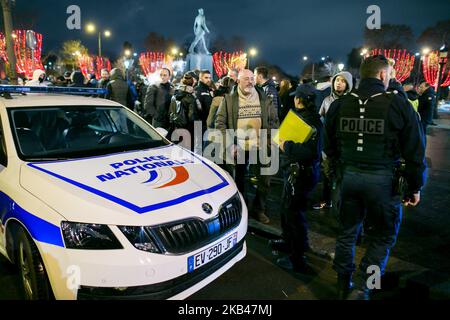 French policemen demonstrate on the Champs Elysées avenue on December 20, 2018 in Paris to the call of MPC (Mouvement of Angry Policemen) for the improvement of their working conditions. After more than one month monitoring Yellow Vest protests, French police officers who were already feeling overworked, say they have had enough. After several hours of negotiations between France's Interior Minister Christophe Castaner and France's three main police unions, an agreement was finally reached regarding officers' salaries. The French government has agreed to hike police wages and pay the 23 millio Stock Photo