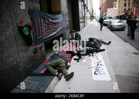 Activist of Die-In for Amazonia protest with Extinction Rebellion & MACC NYC at the Consulado-Geral do Brasil in New York on 1st January 2019. The Die-In for Amazonia protest comes as the new far-right president Jair Bolsonaro is inaugurated and his proposed environmental policies. (Photo by Karla Ann Cote/NurPhoto) Stock Photo