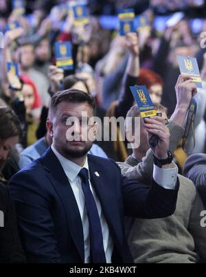 Andriy Biletsky, the leader of the National Corps Ukrainian nationalists party, (C) votes during a solemn convention of the National Corps party in Kiev, Ukraine, 25 January, 2019. Andriy Biletsky declared that he would not take part in the presidential elections on March 31, but the National Corps party would take part in the parliamentary elections to be held in the autumn of 2019. (Photo by NurPhoto) Stock Photo