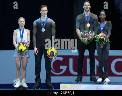 Second placed Russia?s Evgenia Tarasova and Vladimir Morozov, winners France?s Vanessa James and Morgan Cipres celebrate with their medals during the podium ceremony after the pairs' free skating event at the ISU European Figure Skating Championships in Minsk. (Photo by Igor Russak/NurPhoto) Stock Photo