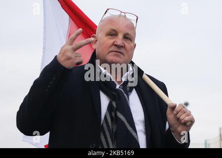 Piotr Rybak, previously jailed for burning effigy of Haredi Jew, takes part in a far-right activists and nationalistic groups march through the streets of Osiwecim city to Auschwitz concentraation camp during the 74th anniversary of the liberation of the Nazi death camp. Oswiecim, Poland on 27 January, 2019. The organizers of the march accuse of remembering only Jews and not murdered Poles in Auschwitz. (Photo by Beata Zawrzel/NurPhoto) Stock Photo