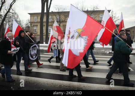 Far-right activists and nationalistic groups march through the streets of Osiwecim city to Auschwitz concentraation camp during the 74th anniversary of the liberation of the Nazi death camp. Oswiecim, Poland on 27 January, 2019. The organizers of the march accuse of remembering only Jews and not murdered Poles in Auschwitz. (Photo by Beata Zawrzel/NurPhoto) Stock Photo