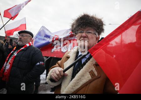 Far-right activists and nationalistic groups march through the streets of Osiwecim city to Auschwitz concentraation camp during the 74th anniversary of the liberation of the Nazi death camp. Oswiecim, Poland on 27 January, 2019. The organizers of the march accuse of remembering only Jews and not murdered Poles in Auschwitz. (Photo by Beata Zawrzel/NurPhoto) Stock Photo