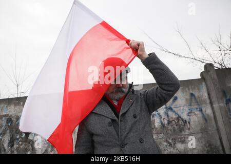 Far-right activists and nationalistic groups march through the streets of Osiwecim city to Auschwitz concentraation camp during the 74th anniversary of the liberation of the Nazi death camp. Oswiecim, Poland on 27 January, 2019. The organizers of the march accuse of remembering only Jews and not murdered Poles in Auschwitz. (Photo by Beata Zawrzel/NurPhoto) Stock Photo