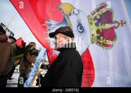 Far-right activists and nationalistic groups march through the streets of Osiwecim city to Auschwitz concentraation camp during the 74th anniversary of the liberation of the Nazi death camp. Oswiecim, Poland on 27 January, 2019. The organizers of the march accuse of remembering only Jews and not murdered Poles in Auschwitz. (Photo by Beata Zawrzel/NurPhoto) Stock Photo