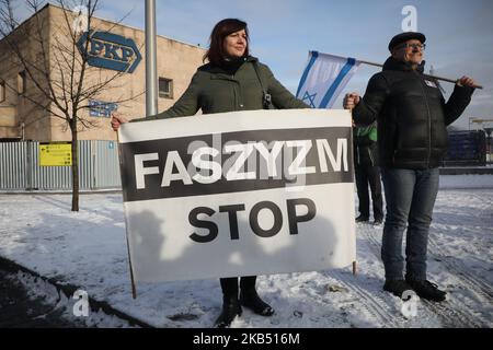 'Stop Facism' banner is held during a far-right activists and nationalistic groups march through the streets of Osiwecim city to Auschwitz concentraation camp during the 74th anniversary of the liberation of the Nazi death camp. Oswiecim, Poland on 27 January, 2019. The organizers of the march accuse of remembering only Jews and not murdered Poles in Auschwitz. (Photo by Beata Zawrzel/NurPhoto) Stock Photo