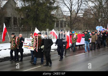 Far-right activists and nationalistic groups march through the streets of Osiwecim city to Auschwitz concentraation camp during the 74th anniversary of the liberation of the Nazi death camp. Oswiecim, Poland on 27 January, 2019. The organizers of the march accuse of remembering only Jews and not murdered Poles in Auschwitz. (Photo by Beata Zawrzel/NurPhoto) Stock Photo