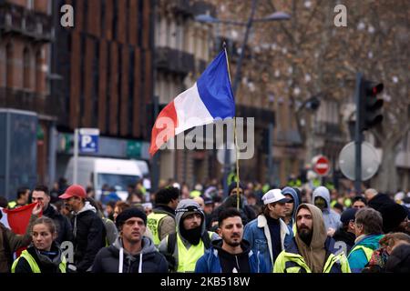 For the Act XI of the Yellow Vest movement, more than 10 000 people took to the streets of Toulouse for the anti-governement protest. Skirmishes took place between protesters and riot police during 3 hours. Riot police used of tear gas canister and one police water cannon. The Yellow Jackets movement begun on November 17th by a protest against the rise of taxes on oil products. The rise of taxes was the detonator of their wrath against French President Macron and his governement and their demand of his resignation.Toulouse. France. January 26th 2019. (Photo by Alain Pitton/NurPhoto) Stock Photo