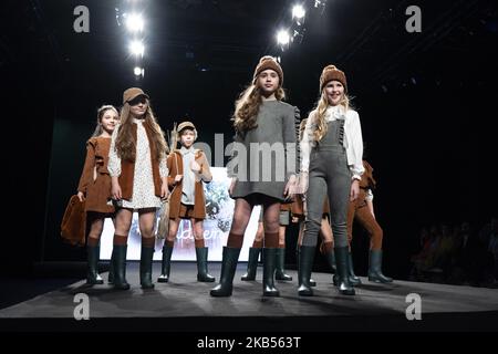 Models walk the runway at the fashion show during the FIMI (Feria Internacional de Moda Infantil y Juvenil) Kids Fashion Week on June 22, 2018 in Madrid, Spain. (Photo by Oscar Gonzalez/NurPhoto) Stock Photo