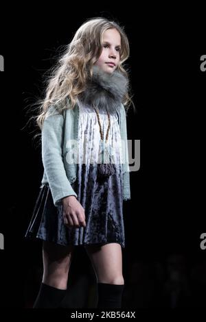 Models walk the runway at the fashion show during the FIMI (Feria Internacional de Moda Infantil y Juvenil) Kids Fashion Week on June 22, 2018 in Madrid, Spain. (Photo by Oscar Gonzalez/NurPhoto) Stock Photo